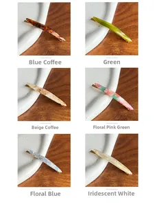 Detail view of six colorful acetate spring hair clips with vintage patterns and textures