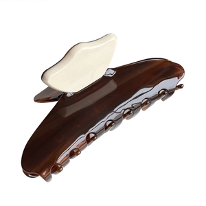 Elegant large tortoiseshell acetate claw clip with cream contrast handle for hair updo