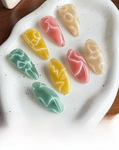 Close-up of geometric water ripple hair clips on a white ceramic tray with soft lighting