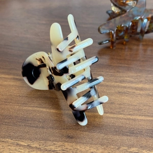 Elegant marble pattern acetate hair claw clip with cream and black tortoiseshell finish