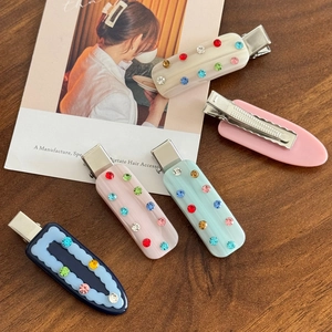 Elegant colorful rhinestone hair clips in acetate finish for a chic French look
