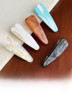 Set of five elegant acetate triangle hair clips featuring marble and tortoise patterns