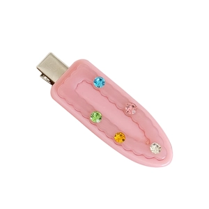 Pink acetate hair clip featuring five colorful rhinestones on a white background