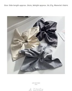 Detail view of large striped scrunchies with dimensions 26cm and fabric texture
