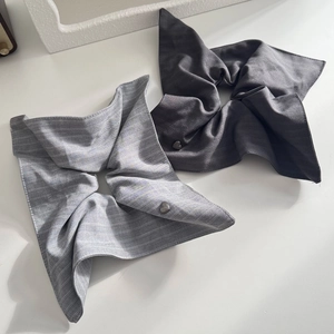 Striped grey and charcoal scrunchies with heart charm accessories in a minimalist set