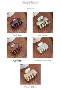 Detailed close-up of high-quality acetate hair claws in various marble textures and colors