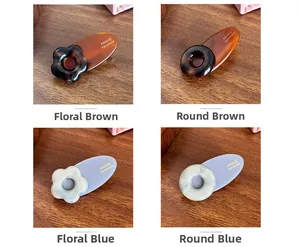 Détails de barrettes à fleurs faites à la main en acétate ambré et bleu de haute qualité