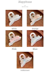 Macro details of fishbone hair claws in five marble colors with pearlescent finish