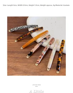 Detailed size view of retro acetate hair clips in leopard and amber patterns