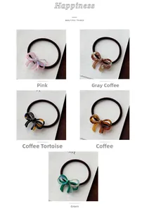 Detail showing five assorted acetate bow hair ties with elegant marble and tortoiseshell patterns