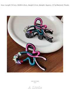 Detailed view of rhinestone butterfly hair claw clip with size measurements on wood
