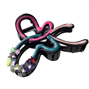 Colorful rhinestone bow hair claw clip with heart and star accents for women