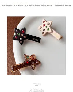 Detailed view of acetic acid star hair clips with rhinestones in 5.5cm size