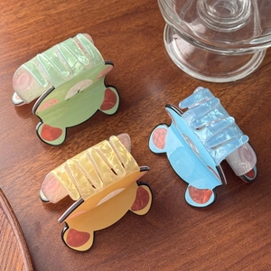 Three cute cartoon bear hair claws in mint green, light blue, and yellow marble texture