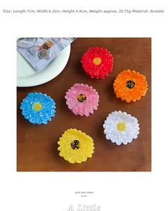 Daisy acetate hair claws in 6 colors showing dimensions 7x6.2x4.4cm on wooden background