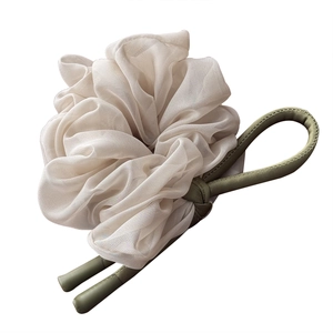 Elegant off-white sheer oversized scrunchie with military green leather accent strap