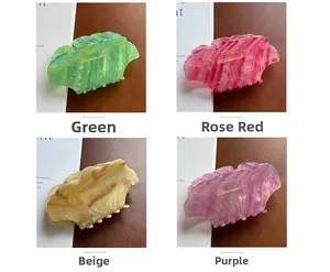 Collage of four large acetate hair claws in green, rose red, cream and purple