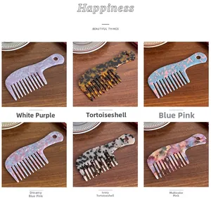 Detail showing various acetate wide-tooth hair combs in marble and tortoiseshell patterns