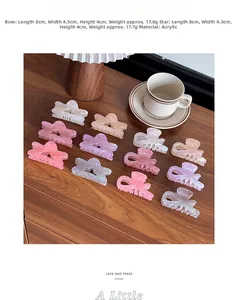 Detailed view of Morandi-toned acrylic hair clips with star and ribbon designs