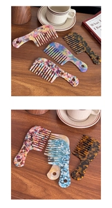 Macro detail of wide-tooth acetate hair combs with colorful marble and tortoise patterns