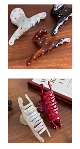 Macro detail of high-quality acetic acid shark hair clips with sparkling colorful rhinestones