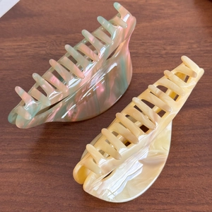 Large acetate shark hair clips in iridescent laser and cream marble textures