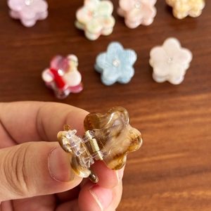 Mini floral acetate hair claw clip with crystal center in marble brown finish