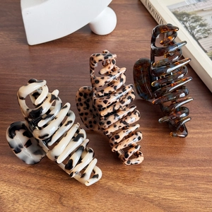Three premium 4mm thick acetate octopus hair claws in leopard and tortoise patterns