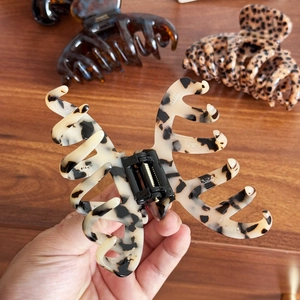 Set of three large acetate octopus hair claws with marble and tortoise shell patterns