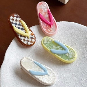 Chic acetate flip-flop hair clips in colorful marble patterns for women's hair styling