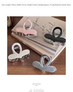 Detailed size view of silver metal hair claw clips with resin marble texture labels