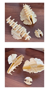 Detailed set of three acetate leaf hair claws with elegant marble texture and metal spring