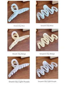 Detail showing translucent jelly-colored hair clips in wave and shark shapes on wood