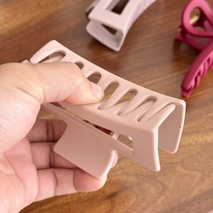 Unbreakable silicone shark hair claw clips in matte pink and burgundy colors