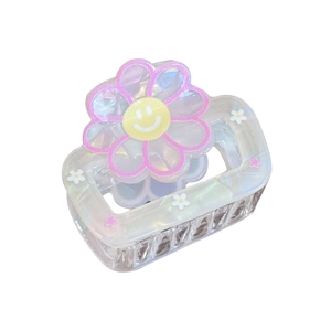 Pince à cheveux fleur mignonne avec fini iridescent et smiley pour queue de cheval haute