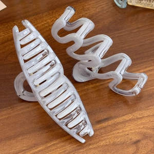 Elegant large gray marble hair claws with ribbon wave design for stylish hair buns