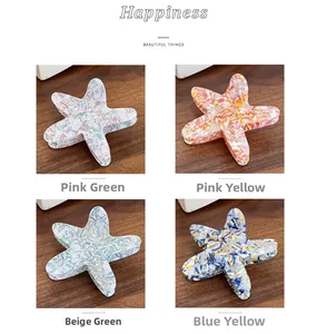 Medium acetate star-shaped hair claw clips set with elegant pearlescent shell texture