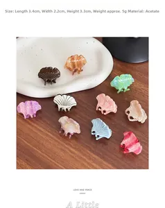 Macro shot of mini shell-shaped acetic acid hair clips in multiple pastel colors