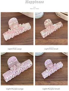 Comparison of large and small floral acetate claw clips in pink and purple colors