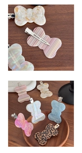 Detailed view of acetate bow hair clips with leopard print and marble textures