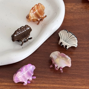 Mini acetate ginkgo leaf hair claws in amber, silver, and purple marble patterns