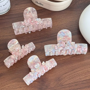 Elegant acetate flower hair claws with rhinestones in pink and marble patterns