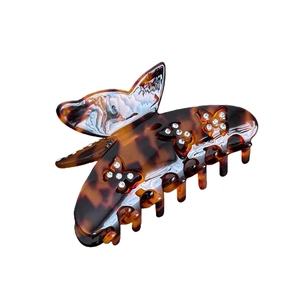 Elegante pinza per capelli a farfalla in acetato ambrato con strass scintillanti