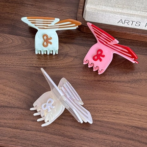 Three-piece set of butterfly acetate hair claws in pastel mint, pink, and white tones