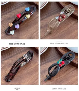 Detail showing various candy-colored hair clips with cherry and leopard heart patterns