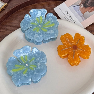 Pinces à cheveux en acétate en forme de fleur avec strass bleu ciel et orange ambré