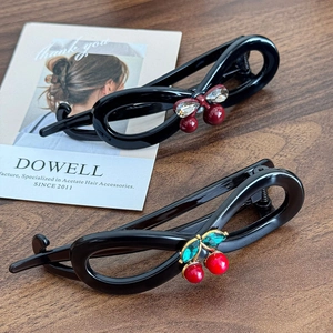 Two-piece cherry hair clips set in black acetate with red and green rhinestones