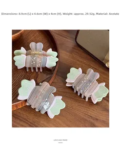 Detail view of acetate shark hair clip with stripes and rhinestones, size 8.9x4.6x4cm