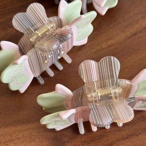Elegant butterfly hair claw clips in pastel acetate with sparkling rhinestones set on wood