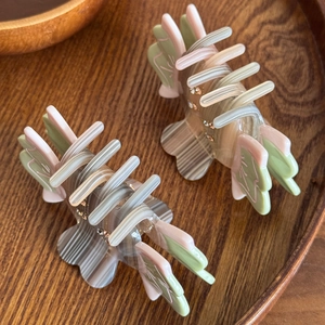 Elegant marble pattern acetate hair claws with butterfly wings and rhinestone accents